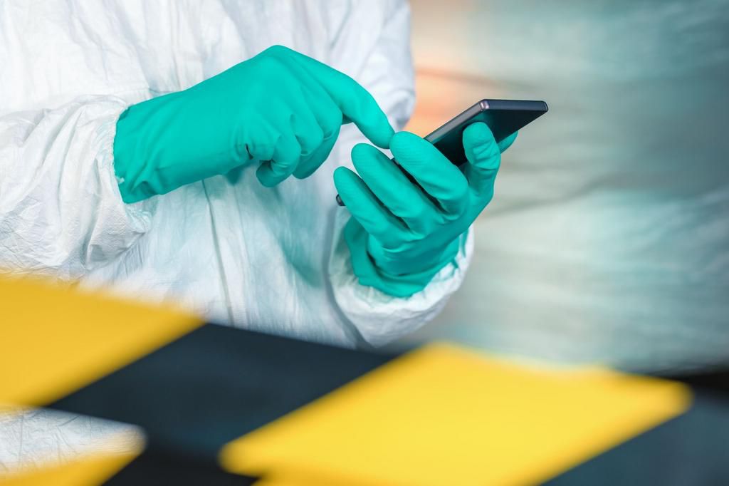 Epidemiologist using smartphone in Wuhan coronavirus quarantine