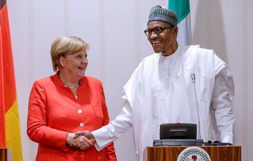 President Buhari in a handshake with German Chancellor Merkel at the State House (Thisday)