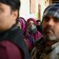 Voters queue to cast their ballots in Delhi's local elections on Saturday