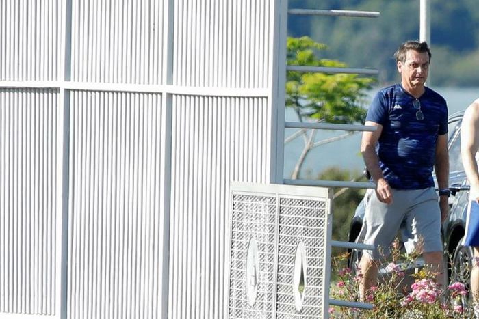 Brazilian President Jair Bolsonaro, pictured in Brasilia March 13, 2020, made a US visit that looks like an infection cluster in the coronavirus pandemic