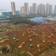 Workers toiled day and night amid a forest of earthmovers and trucks carting goods around the site, southwest of the centre of the city of 11 million