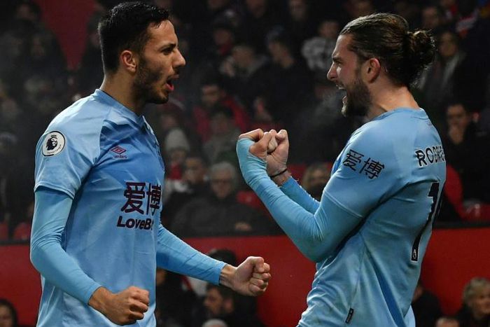 Jay Rodriguez (R) celebrates scoring Burnley's second goal at Manchester United