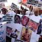 Wearing T-shirts that read #justicemustprevail, the protesters held photographs of people killed during Jammeh's rule