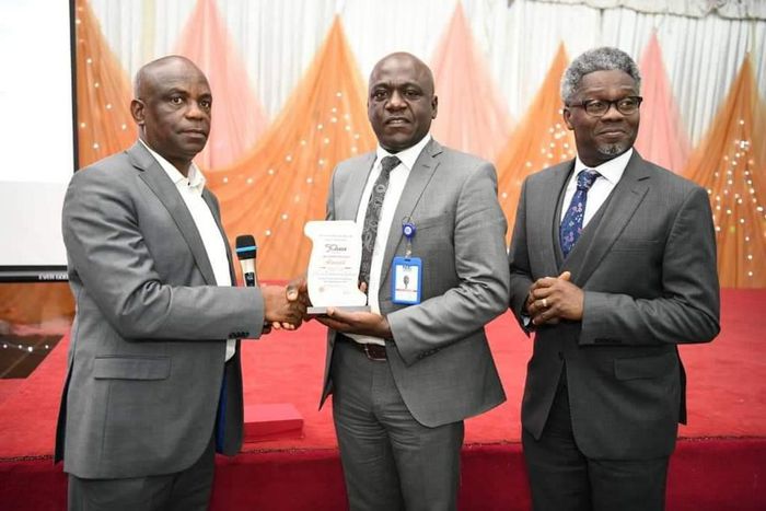 L-R: Glory Idehen, President, Information Systems Audit and Control Association (ISACA), Abuja Chapter; Abraham Oshadame, Head, Information Technology, Nigerian Communications Commission (NCC) and Omoniyi Ibietan, Head, Online Media & Special Publicati...