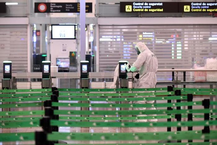 Members of Spain's Military Emergencies Unit (UME) carry out a general disinfection at Josep Tarradellas Barcelona-El Prat airport in El Prat de Llobregat on March 19, 2020