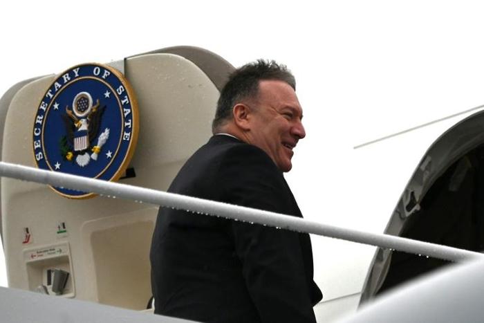 US Secretary of State Mike Pompeo boards his plane at Andrews Air Force Base en route to Munich on a trip that will include his first tour of sub-Saharan Africa