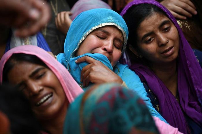Relatives of Mohammad Mudasir, 31, who died in the sectarian riots in India's captial over Prime Minister Narendra Modi's citizenship law, mourn during his funeral in New Delhi