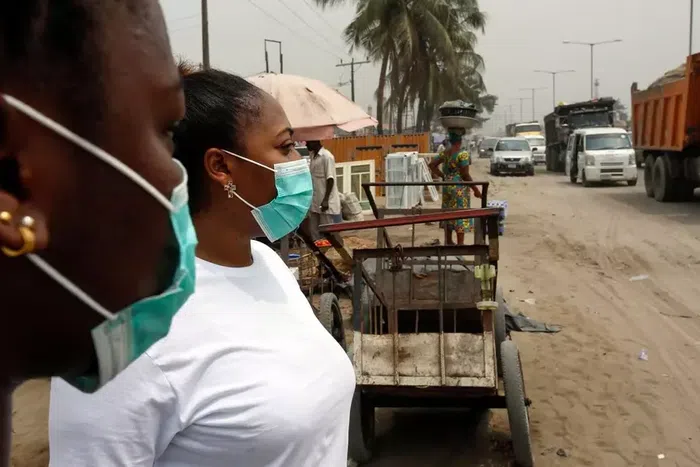 Ladies with nose mask to prevent against Coronavirus in Nigeria/Illustration (Washington Post)
