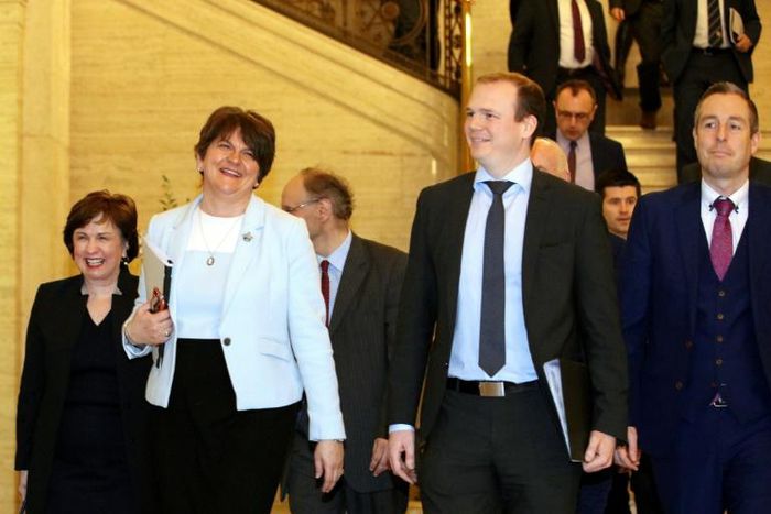 Northern Ireland's Democratic Unionist Party (DUP) leader Arlene Foster (second left), with party colleagues, make their way into a session of the Northern Ireland Assembly after reaching agreement with Republican Sinn Fein on reforming the Stormont ex...