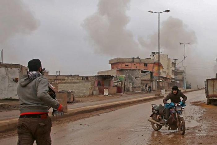 Some of the last remaining residents of the rebel-held town of Atareb flee as Syrian government forces draw ever closer in their offensive against the last major rebel pocket of Idlib