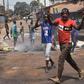 Protesters burn rubbish and block roads along the "axis of democracy" as demonstrations broke out in Conakry in February 2020 after Guinea's President Alpha Conde postponed a parliamentary election