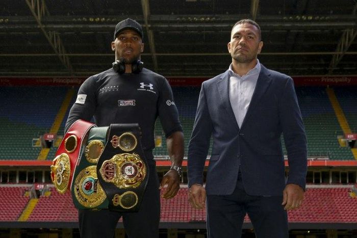 Britain's Anthony Joshua (L) and Bulgaria's Kubrat Pulev (R) pose at the Principality Stadium in Cardiff on September 11, 2017 during a promotional event for their heavyweight world title boxing match