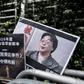 Placards showing missing bookseller Lee Bo (left) and his associate Gui Minhai (right) are left outside the China liaison office in Hong Kong following a January 2016 protest
