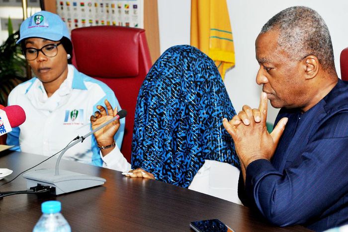 Minister of Foreign Affairs, Geoffery Onyeama (R); Director General, National Agency for the Prohibition of Trafficking in Persons (NAPTIP), Dame Julie OkahDonli (L), and a victim of trafficking, during a news conference on Human trafficking in Abuja o...