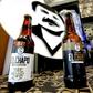 Botellas de la cerveza "El Chapo 701," una marca también de ropa y accesorios con la imagen del narcotraficante mexicano Joaquín "Chapo" Guzmán, en exibición en la 72ª edición de la feria de moda IM Intermoda México, en Guadalajara, México, el 14 de en...