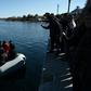 Shouting "Go back to Turkey", furious locals at the port of Thermi blocked migrants from landing