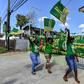 Supporters of presidential candidate David Granger, of the National Unity and Alliance for Change (APNU+AFC) party, cheer and wave flags in Georgetown ahead of Monday's elections in Guyana