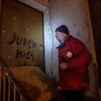 Aldo Rolfi, son of Italian writer Lidia Beccaria Rolfi (1925-1996), a former member of the Italian Resistance who was deported to Ravensbrueck concentration camp as a political prisoner, shows anti-Semitic tags written on his door to protesters