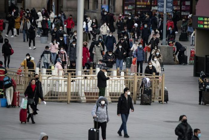 Neighbourhoods in China have ramped up checks on residents returning from virus-hit Hubei province