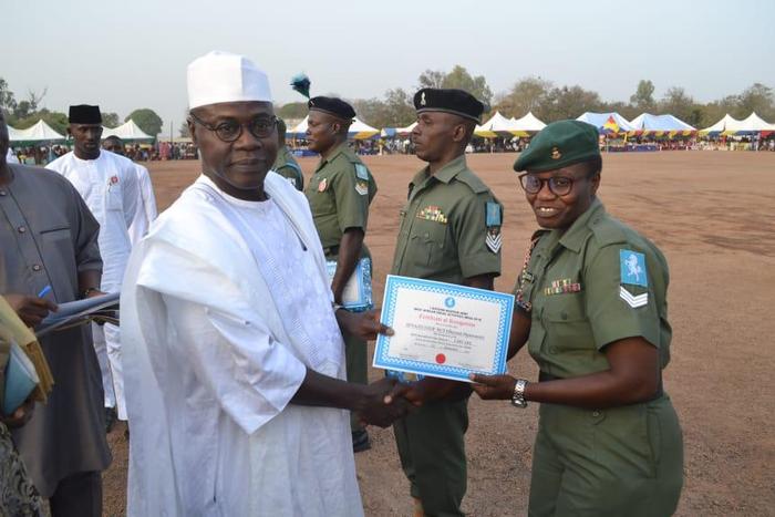 The GOC 1Division Nigerian Army Kaduna, Maj-Gen Faruk Yahaya presenting certificate to a female soldier, during WASA on Saturday in Kaduna (NAN)