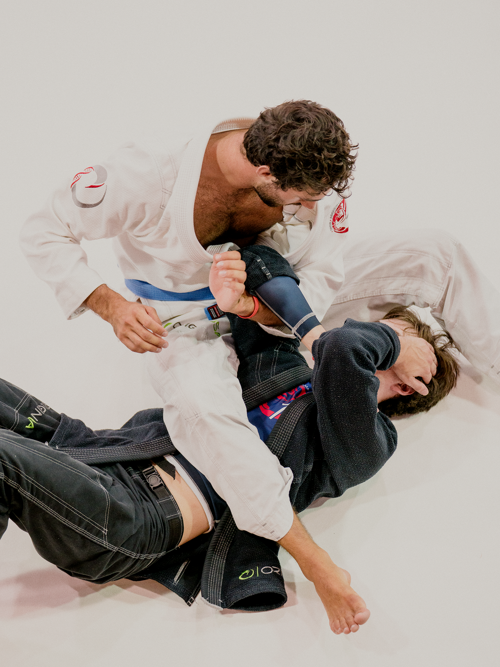 Two advanced students grappling at the camp.