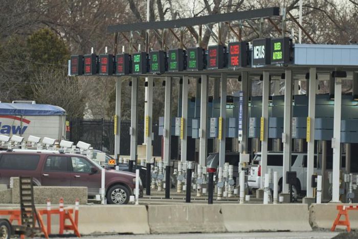Travellers arrive at the Canada Customs booths in Sarnia, Ontario on March 16, 2020