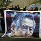 Supporters of Peruvian ex-president Alberto Fujimori (pictured October 2018) hold up posters of the former leader, who has been hospitalized for neurological and pulmonary issues