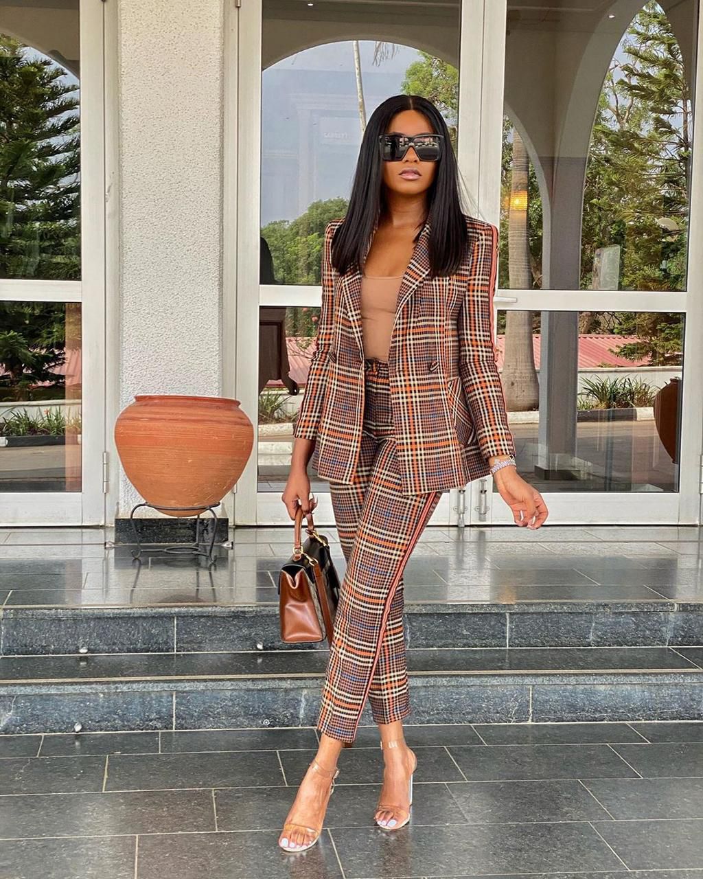 Kiki Osinbanjo wearing a tartan pant suit [Instagram: kikiosinbanjo]
