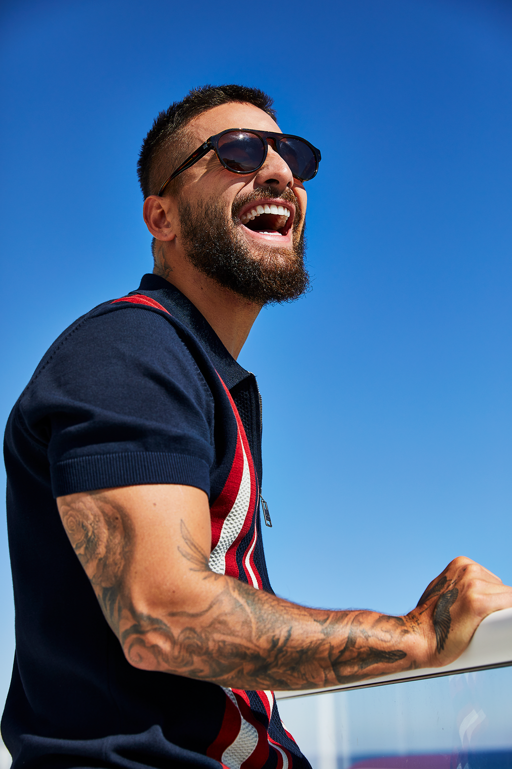 Buy Malumas Look: <a href=&quot;https://www.bensherman.com/collections/mens-polo-shirts/products/59356-25-textured-stripe-zip-through-polo-dark-navy&quot; target=&quot;_blank&quot;>Ben Sherman knit polo</a>; <a href=&quot;https://www.amazon.com/Eyeglas...