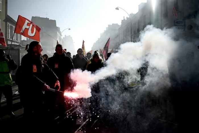 Protesters joined a demonstration in Versailles, where French President Emmanuel Macron was hosting an investment summit