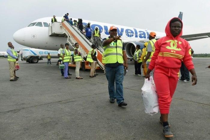 A migrant disembarks from a chartered aircraft that returned 155 Nigerian migrants from Libya at Murtala Mohammed International Airport in Lagos, in March 2017.