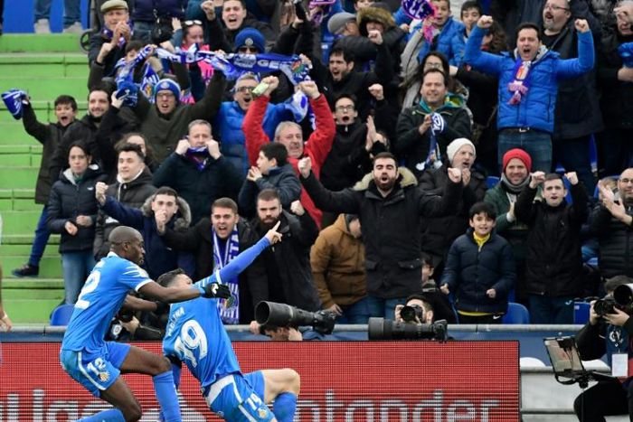 Jorge Molina (right) celebrates scoring in Getafe's 3-0 win over Valencia on Saturday.