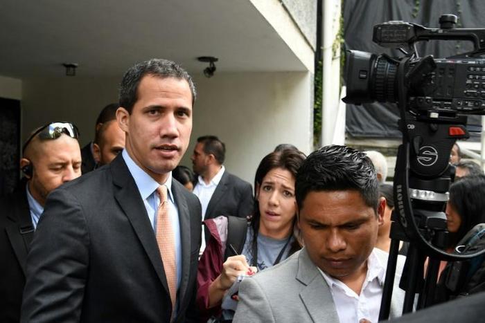 Lawmakers supporting Venezuelan opposition leader and self-proclaimed acting president Juan Guaido (C) say that pro-government loyalists opened fire at them