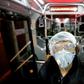 A worker cleans a bus in the Iranian capital Tehran as part of efforts to prevent the spread of coronavirus