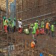 Ethiopian workers stand on scaffolding in 2015 during the construction of the Grand Renaissance Dam