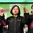Taiwan President Tsai Ing-wen (C) joins hands with Vice President-elect William Lai (L) and current Vice President Chen Chien-jen at campaign headquarters in Taipei on January 11, 2020; she was re-elected in a lopsided vote seen as a blow to China