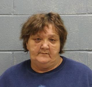 Mother, grandmother and grandfather accused of locking children in wooden cages