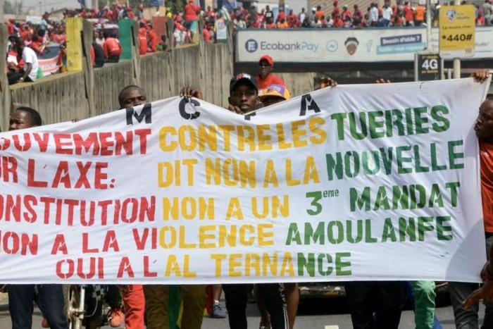 People take part in a January 2020 anti-government rally to protest against President Alpha Conde plans to stay in office for a third term, in Conakry