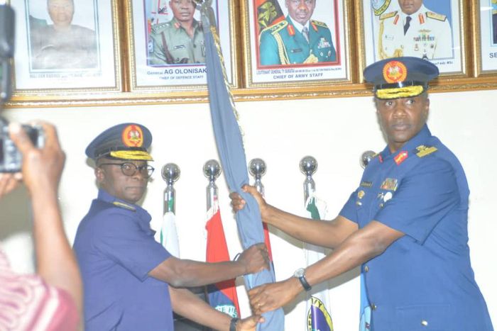 L-R: The new commandant AFCSC, AVM Abubakar Lima, receiving the college flag from out going commandant AVM Lawal Alao during the handing over ceremony on Wednesday in Jaji Kaduna (NAN)