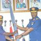 L-R: The new commandant AFCSC, AVM Abubakar Lima, receiving the college flag from out going commandant AVM Lawal Alao during the handing over ceremony on Wednesday in Jaji Kaduna (NAN)