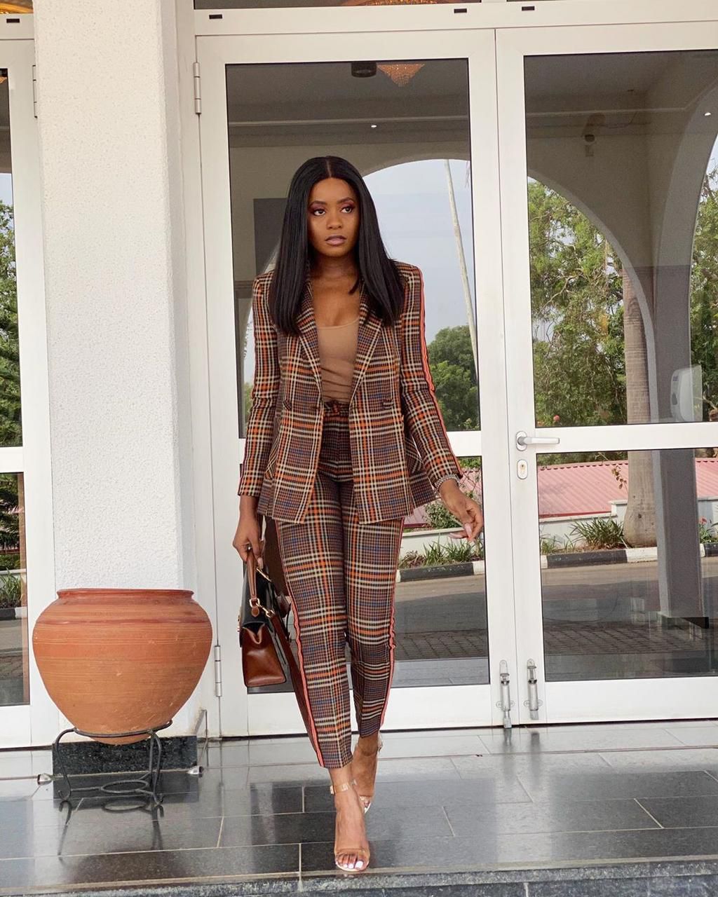 Kiki Osinbanjo wearing a tartan pant suit [Instagram: kikiosinbanjo]