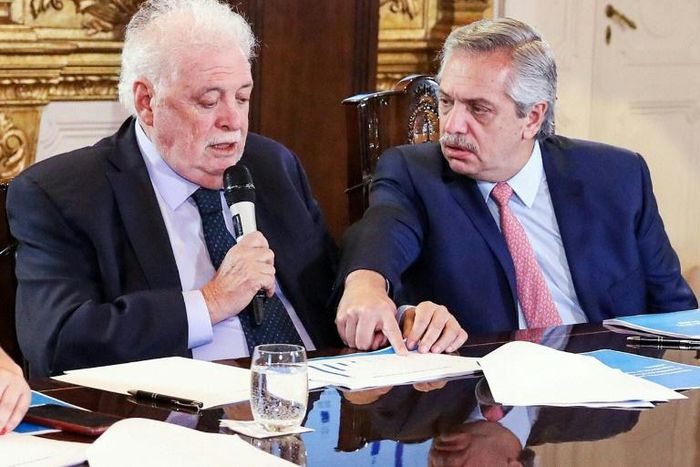 Argentina's President Alberto Fernandez (R) and Health Minister Gines Garcia at a cabinet meeting on tackling the coronavirus outbreak