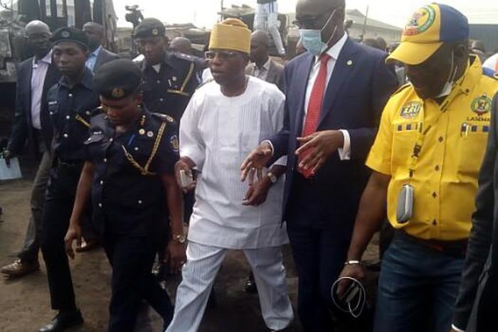 Mr Mele Kyari, Group Managing Director, Nigerian National Petroleum Corporation (in suit)  flanked by Dr Olufemi Oke-Osanyintolu, Director General, Lagos State Emergency Management Agency and Mr Wale Ahmed, Lagos State Commissioner for Special Duties a...