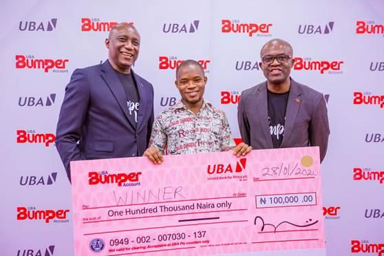 L-R: Group Head, Retail Banking, United Bank for Africa(UBA) Plc, Jude Anele; A winner in the UBA Bumper Account Promo,  Amos Wisdom; and Head Brand Management, UBA Plc, Lashe Osoba. during the launch of UBA Bumper Account and the 1st Draw of the UBA ...
