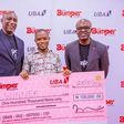 L-R: Group Head, Retail Banking, United Bank for Africa(UBA) Plc, Jude Anele; A winner in the UBA Bumper Account Promo,  Amos Wisdom; and Head Brand Management, UBA Plc, Lashe Osoba. during the launch of UBA Bumper Account and the 1st Draw of the UBA ...