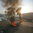 Anti-government protesters tried Monday to block central Baghdad streets with burning tyres