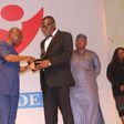 Director, Public Affairs, Nigerian Communications Commission (NCC), Dr. Henry Nkemadu (right) receiving the award at the event.