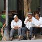Members of China's Uighur minority outside a coffee bar in the restored old city area of Kashgar, a tourist magnet just a stone's throw from internment camps