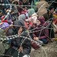 Through the barricades: Thousands of migrants have pushed up to the Turkey-Greece border