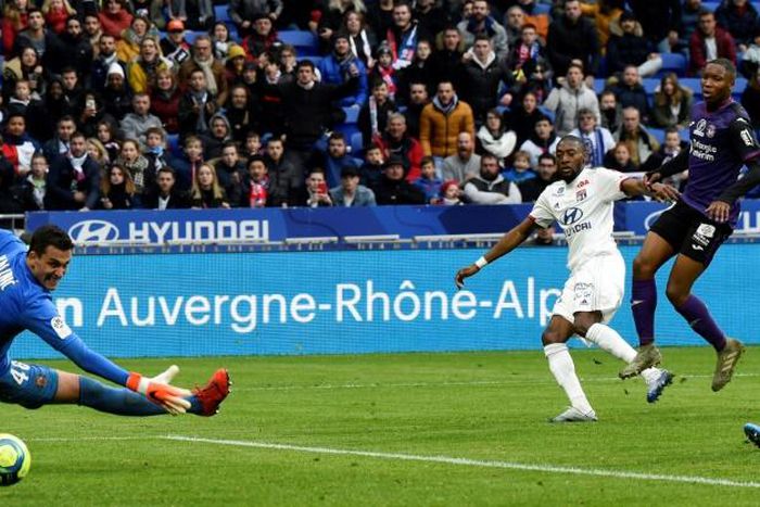 Karl Toko Ekambi (R) scored on his Lyon debut after coming on as a first-half substitute